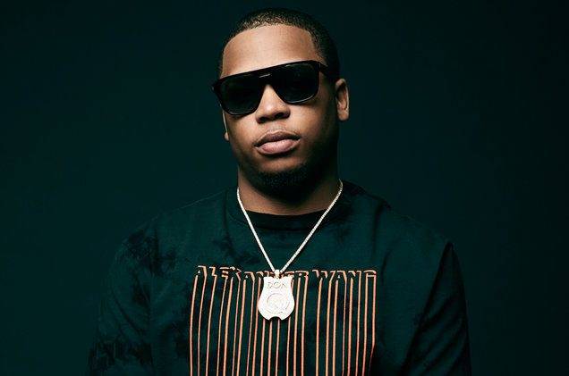 young black rapper in glasses