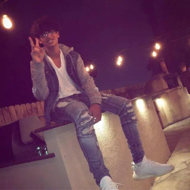 Luclover rapper in urban outfit and white sneakers